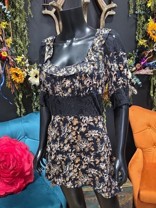 Floral babydoll dress on a mannequin in the shop